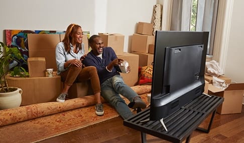 couple sitting at TV